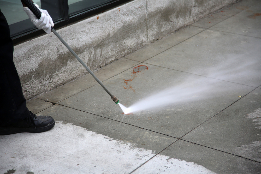 Pressure,Washing.,An,Unidentifiable,City,Employee,Power,Washes,Blood,Or